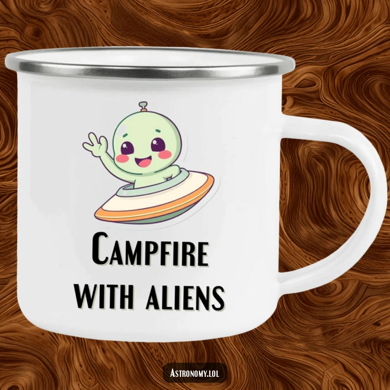 Funny alien camping mug featuring a smiling character waving from a spaceship, perfect for enjoying drinks outdoors.