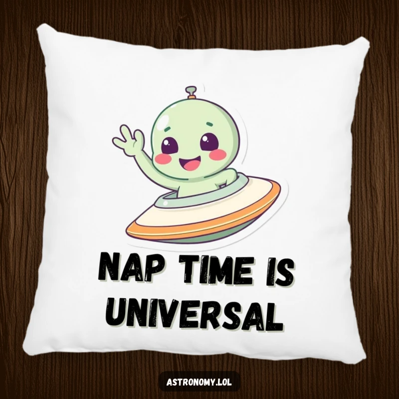 Funny alien pillow featuring a smiling extraterrestrial waving from a spaceship, designed for comfort and humorous decor.