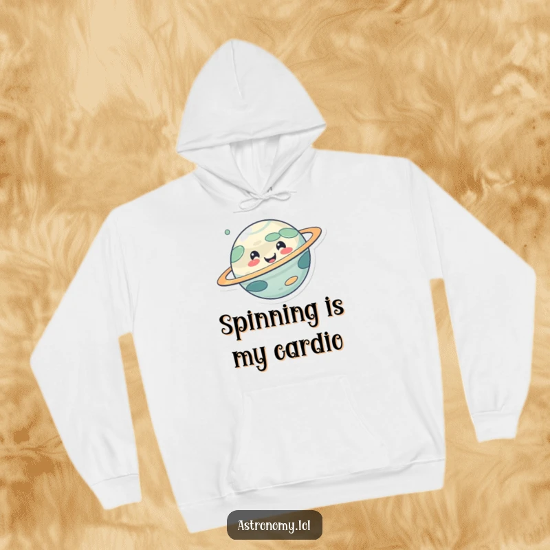Funny hoodie depicting a cute, smiling planet character happily spinning, emitting warmth and cheerful cosmic energy.