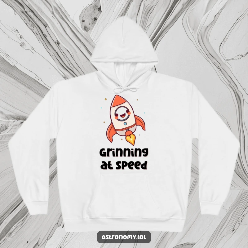 Funny rocket ship hoodie featuring a happy, grinning character blasting off, offering warmth and motivational humor.