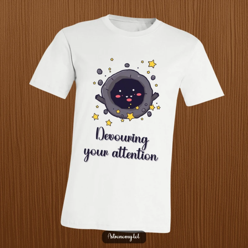 Funny t-shirt with a mischievous black hole character playfully absorbing small stars, showcasing cosmic mischief. Cool gift.