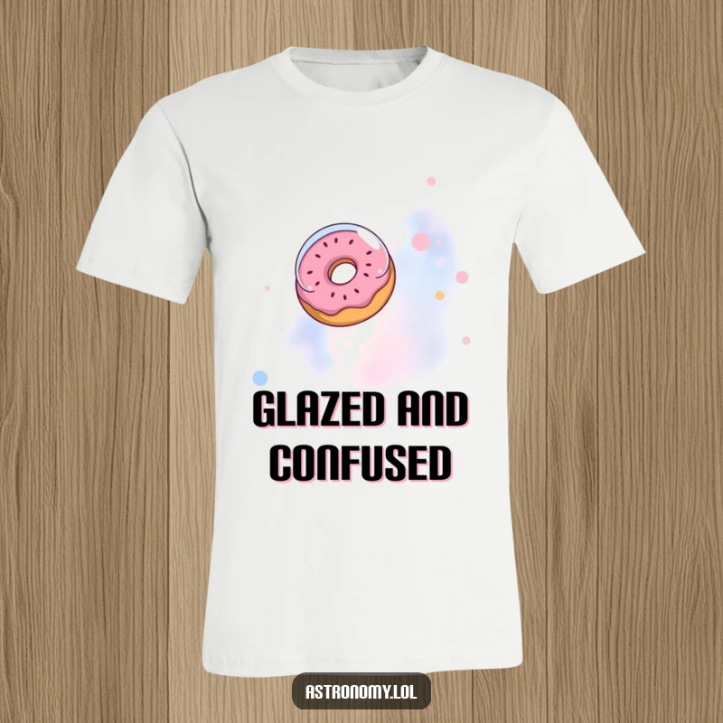 Funny t-shirt: A silly donut with a tiny astronaut helmet floats in a vibrant nebula, a cosmic foodie.