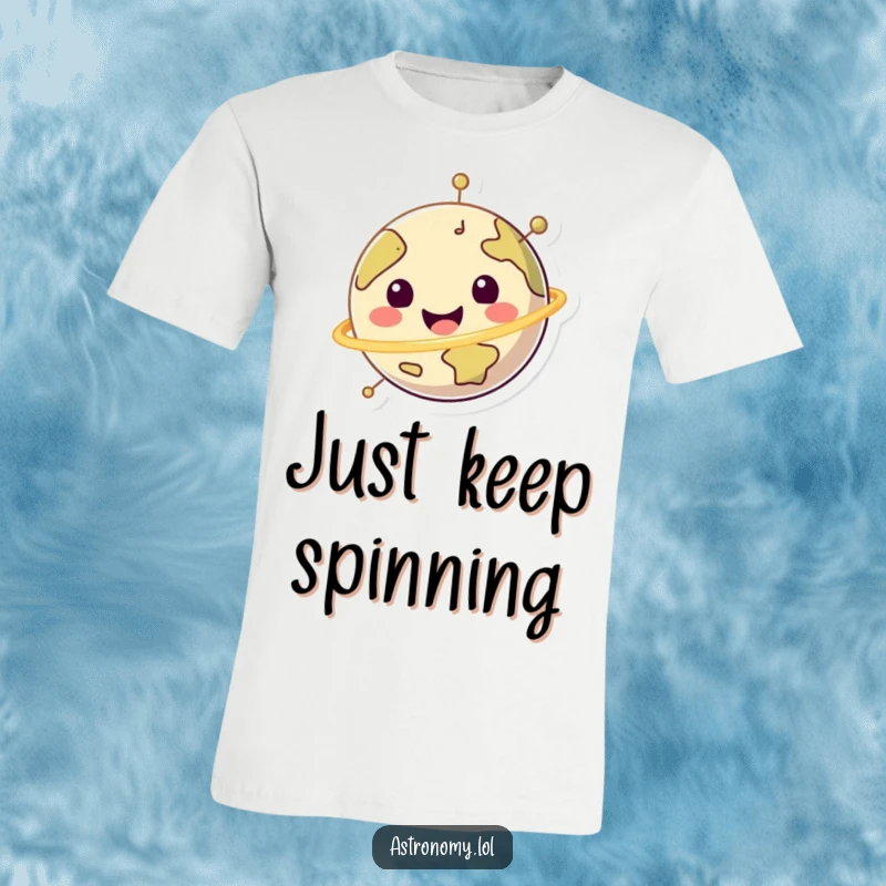 Funny happy planet character in a joyful spin on a t-shirt, promoting planetary cheerfulness and fun.