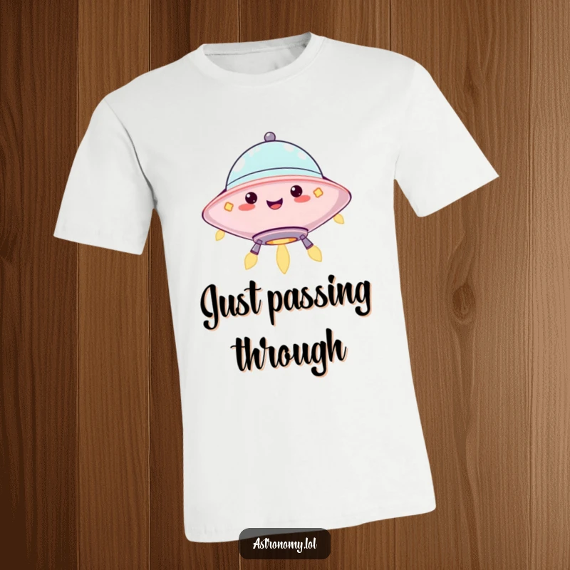 Funny t-shirt showing a jolly UFO character hovering with cheerful, blinking lights, ready for adventure. Perfect gift.