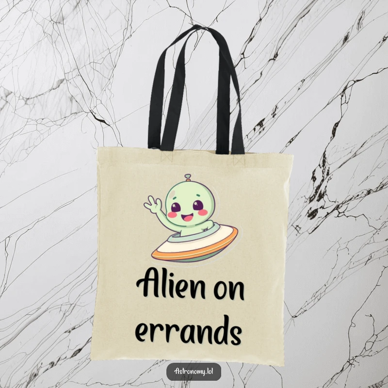 Funny alien tote bag showing a smiling character excitedly waving from the window of a flying spaceship.