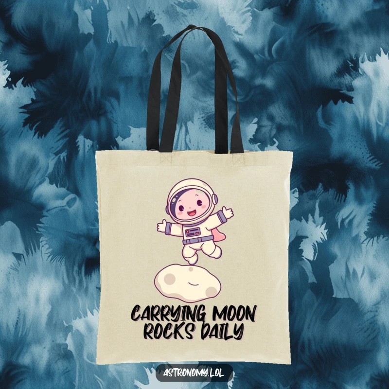 Funny tote bag showcasing a happy astronaut character mid-bounce on the moon, perfect for carrying groceries with galactic glee.