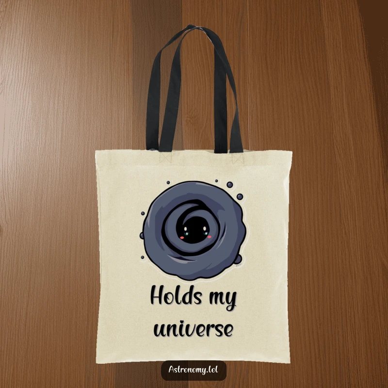 Funny Black Hole Tote Bag with a curious character and swirling vortex, designed for carrying groceries and cosmic jokes with style.